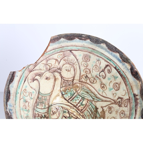 28 - PERSIAN BAMIYAN SGRAFFIATO BOWL 12TH-14TH CENTURY. With two birds surrounded by scrolls and multiple... 