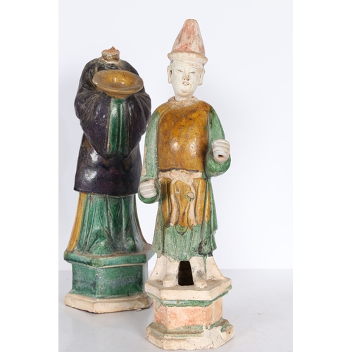 33 - TWO CHINESE POTTERY TOMB ATTENDANTS. Probably Tang Dynasty, both standing, one with hands raised and... 