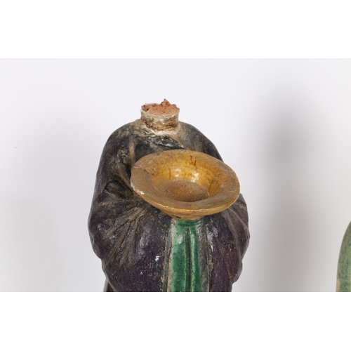 33 - TWO CHINESE POTTERY TOMB ATTENDANTS. Probably Tang Dynasty, both standing, one with hands raised and... 