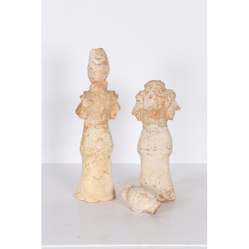 34 - TWO CHINESE TERRACOTTA ATTENDANTS. Both standing with arms to the chest, 44cm high, (2).