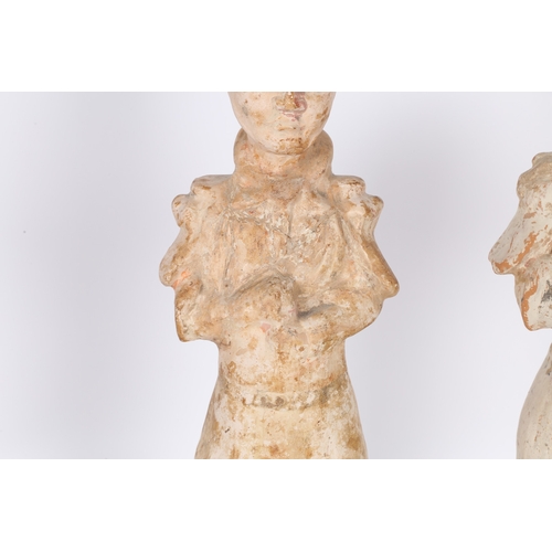 34 - TWO CHINESE TERRACOTTA ATTENDANTS. Both standing with arms to the chest, 44cm high, (2).