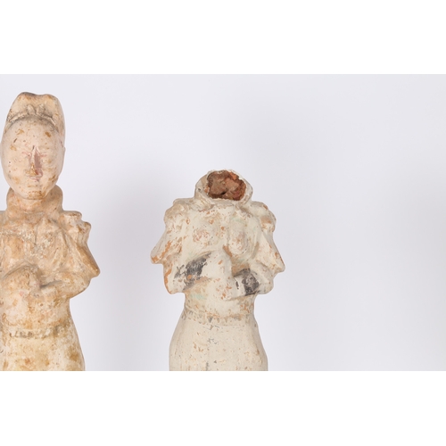 34 - TWO CHINESE TERRACOTTA ATTENDANTS. Both standing with arms to the chest, 44cm high, (2).