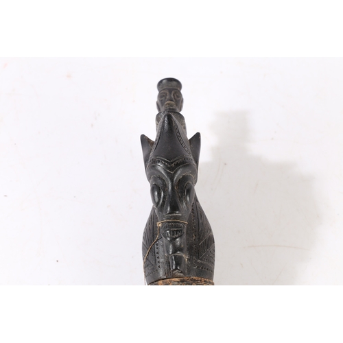 43 - AN AFRICAN CARVED CALENDAR. An African carved calendar of cylindrical form, 20th century, having a f... 