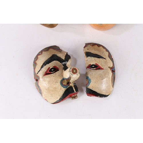 47 - THREE HAND PAINTED MASKS. Three hand painted masks, possibly Balinese, one having a gilt painted fac... 