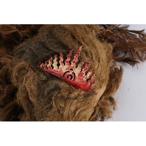 48 - A TRIBAL MASK. A Tribal mask, 20th century, formed of long knotted hairs.