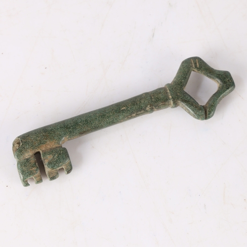 5 - AN ENGLISH MEDIEVAL KEY. With loop bow and two bits, 9cm long. 
Found in Suffolk.