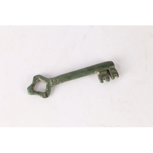 5 - AN ENGLISH MEDIEVAL KEY. With loop bow and two bits, 9cm long. 
Found in Suffolk.