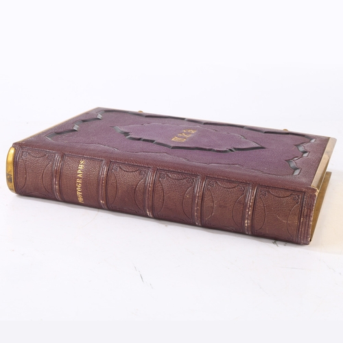 63 - A GOOD VICTORIAN CARTE DE VISITE PHOTOGRAPH ALBUM. The album with a purple tooled binding containing... 