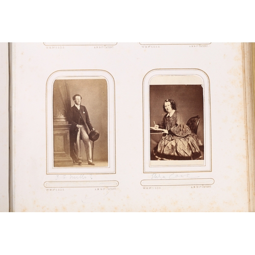 63 - A GOOD VICTORIAN CARTE DE VISITE PHOTOGRAPH ALBUM. The album with a purple tooled binding containing... 