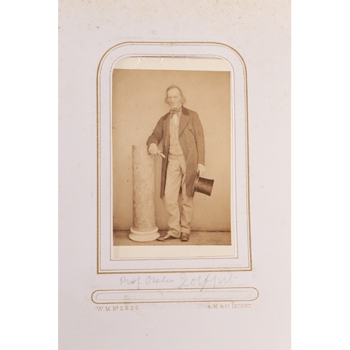 63 - A GOOD VICTORIAN CARTE DE VISITE PHOTOGRAPH ALBUM. The album with a purple tooled binding containing... 