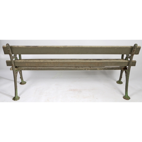 110 - A PAIR OF EDWARDIAN CAST IRON GARDEN BENCHES. the interwoven ends united by slatted backs and seats,... 