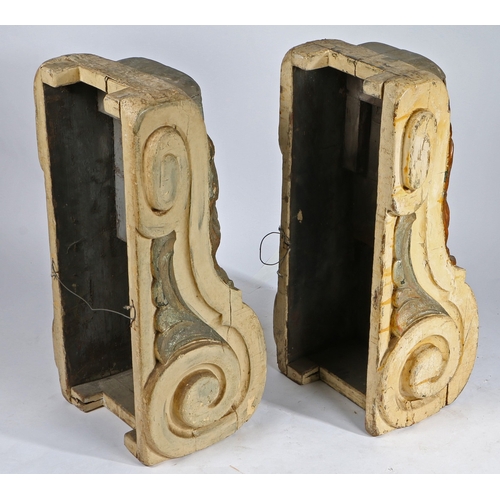 75 - A PAIR OF SUBSTANTIAL POLYCHROME PAINTED CORBELS. each with a central lion mask above an acanthus le... 