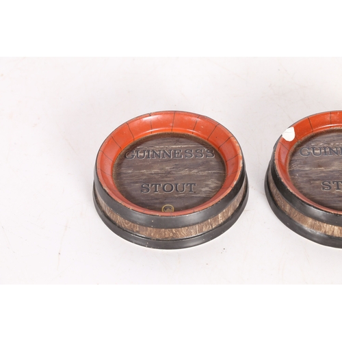 93 - A PAIR OF GUINNESS STOUT ASHTRAYS. manufactured by Ajax, 50 Cannon St. London, modelled as coopered ... 