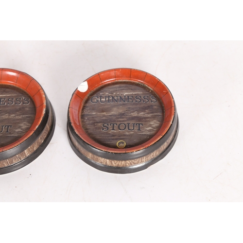 93 - A PAIR OF GUINNESS STOUT ASHTRAYS. manufactured by Ajax, 50 Cannon St. London, modelled as coopered ... 