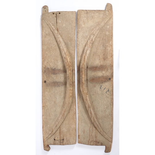 103 - A PAIR OF MIDDLE EASTERN DOORS. each with a carved crescent to one side, each door 225cm high, 53cm ... 