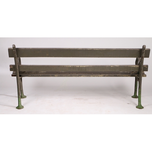 110 - A PAIR OF EDWARDIAN CAST IRON GARDEN BENCHES. the interwoven ends united by slatted backs and seats,... 