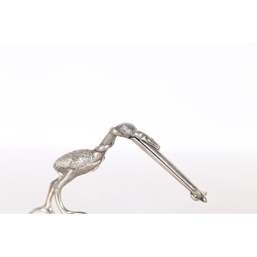 287 - A PAIR OF 19TH CENTURY WHITE METAL RIBBON THREADERS/ SCISSORS. in the form of a stork carrying a swa... 