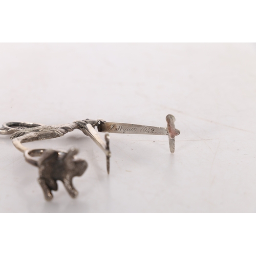 287 - A PAIR OF 19TH CENTURY WHITE METAL RIBBON THREADERS/ SCISSORS. in the form of a stork carrying a swa... 