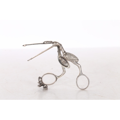 287 - A PAIR OF 19TH CENTURY WHITE METAL RIBBON THREADERS/ SCISSORS. in the form of a stork carrying a swa... 