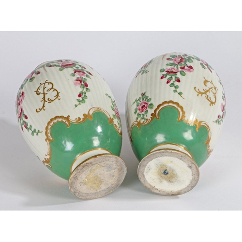 298 - A PAIR OF RARE 18TH CENTURY WORCESTER OVAL TEA CANISTERS, HAND PAINTED WITH ONGLAZE COLOURS. A pair ... 