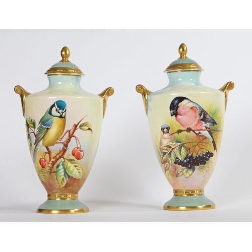 299 - A PAIR OF AYNSLEY 'FINE ART COLLECTION' PORCELAIN, TWIN HANDLED LIDDED VASES. A pair of Aynsley 'Fin... 