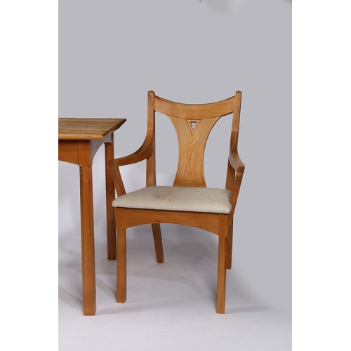 31 - ANDREW BECKWITH GOTHIC REVIVAL TABLE AND TWO ARMCHAIRS. the chairs having a Y shaped slat back with ... 