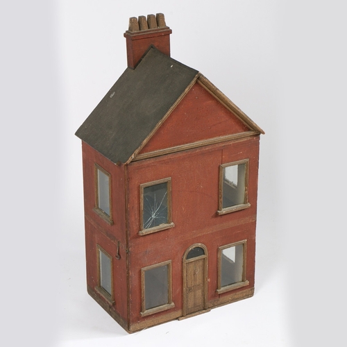 326 - A 19TH CENTURY DOLLS HOUSE. The apex roof with a four chimney stack above a red body with two window... 