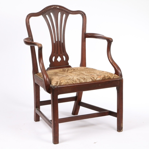 330 - A GEORGE III MAHOGANY CARVER CHAIR. the moulded cresting rail above four reeded tapering splats, the... 