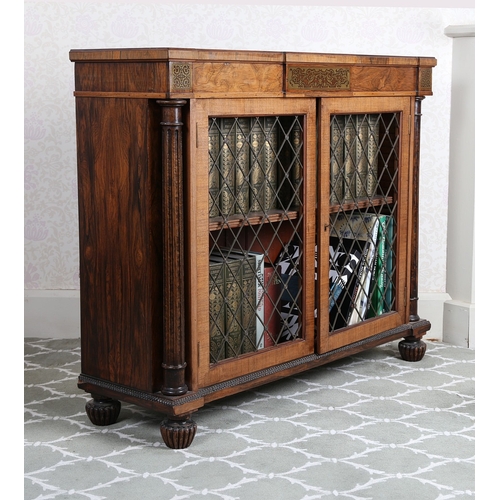 34 - A REGENCY STYLE ROSEWOOD AND MAHOGANY CABINET. of breakfront form, having pierced brass decoration a... 