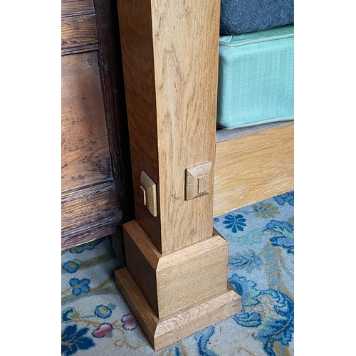 35 - A 20TH CENTURY OAK FOUR POSTER BED. having a stepped frieze and a paneled tester and headboard above... 