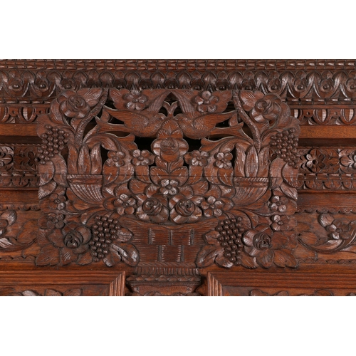 355 - A SUBSTANTIAL EARLY 20TH CENTURY FRENCH OAK ARMOIRE. the foliate and egg and dart pediment above a p... 