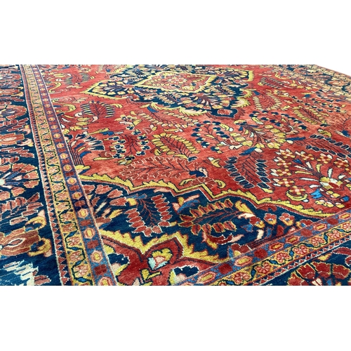 357 - A HAMADAN CARPET. A Hamadan Carpet, the blood red field of flowering plants centred by an indigo med... 