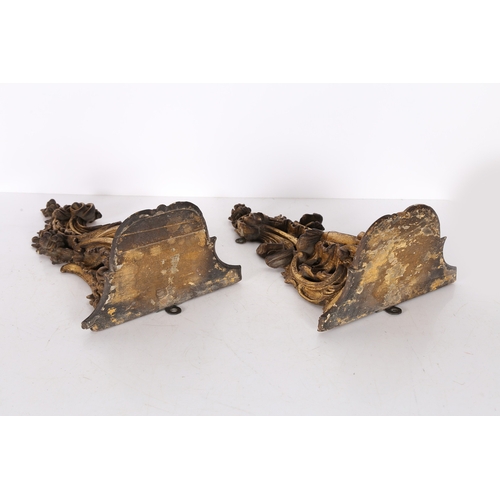 382 - A PAIR OF ROCOCO GILT WOOD BRACKETS. the scroll fronted shelved above pierced foliate and scroll dec... 