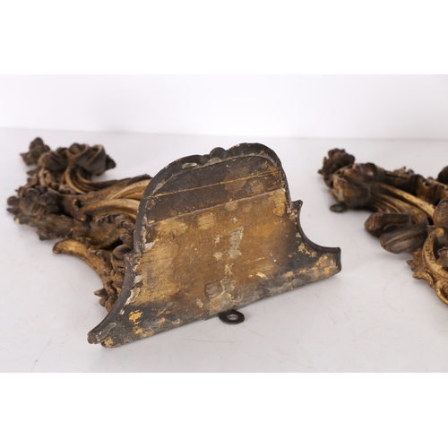 382 - A PAIR OF ROCOCO GILT WOOD BRACKETS. the scroll fronted shelved above pierced foliate and scroll dec... 