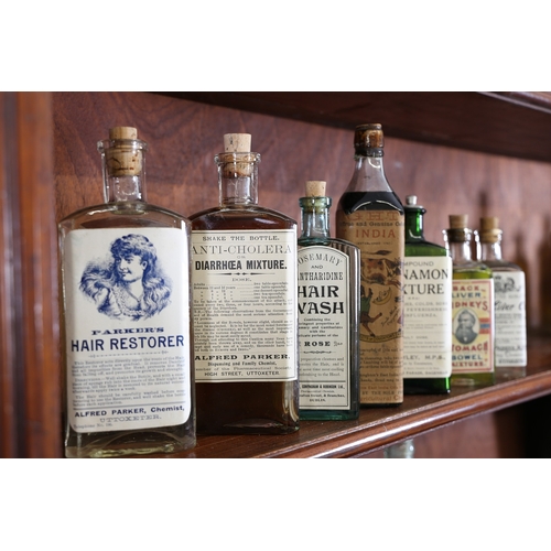 385 - A VICTORIAN AND LATER APOTHECARY CABINET. the open top section with four shelves centred by a reeded... 