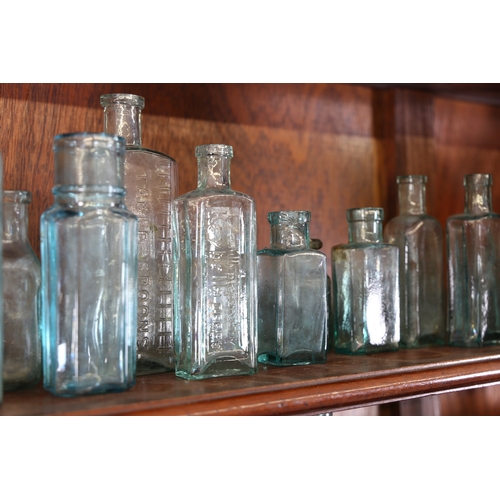 385 - A VICTORIAN AND LATER APOTHECARY CABINET. the open top section with four shelves centred by a reeded... 