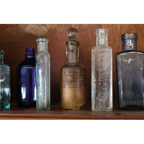 385 - A VICTORIAN AND LATER APOTHECARY CABINET. the open top section with four shelves centred by a reeded... 