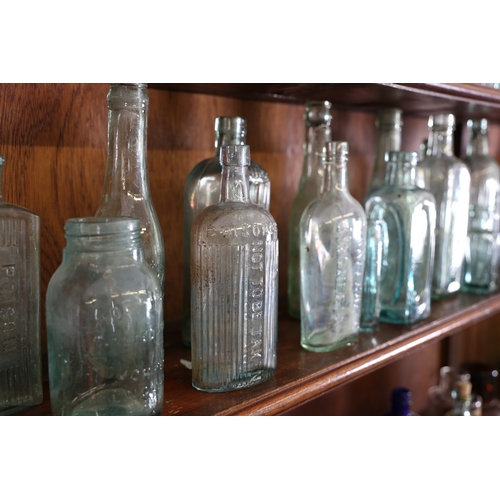 385 - A VICTORIAN AND LATER APOTHECARY CABINET. the open top section with four shelves centred by a reeded... 