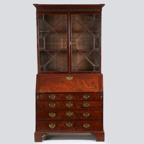 388 - A GEORGE III MAHOGANY BUREAU BOOKCASE. With dentil and blind fret carved pediment, the upper section... 