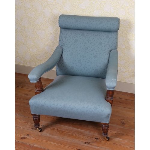 39 - A HOWARD AND SONS TYPE ARMCHAIR. having a scroll back above down swept arms upholstered in a blue fl... 