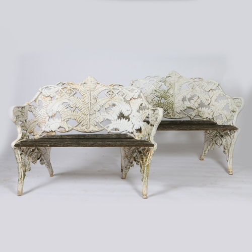 390 - A PAIR OF COALBROOKDALE STYLE CAST IRON FERN AND BLACKBERRY PATTERN GARDEN BENCHES. A pair of Coalbr... 