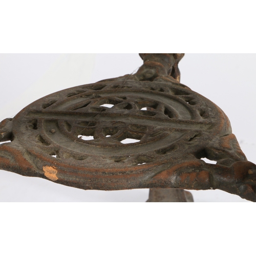 51 - A CAST IRON PUB TABLE. the later dark stained circular top above the cast iron base, the three legs ... 