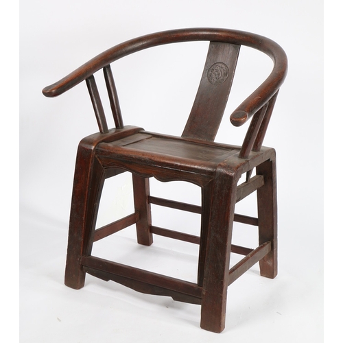 67 - A CHINESE QING DYNASTY HORSESHOE CHAIR. the splat back with carved roundel flanked by two arm suppor... 