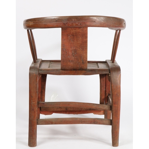 68 - A CHINESE QING DYNASTY HORSESHOE CHAIR. the splat back with central carved roundel surrounded by scr... 