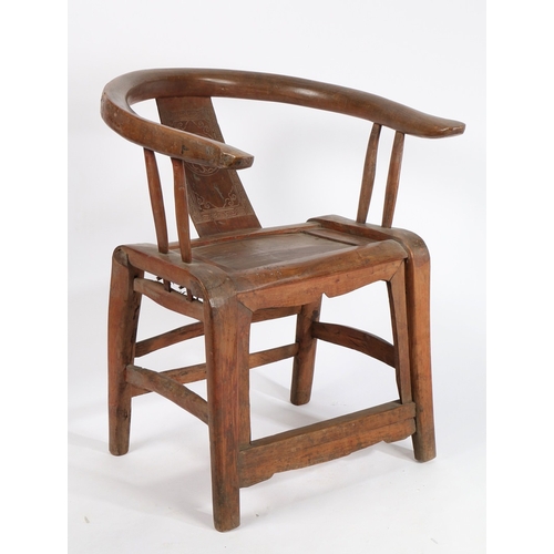 68 - A CHINESE QING DYNASTY HORSESHOE CHAIR. the splat back with central carved roundel surrounded by scr... 