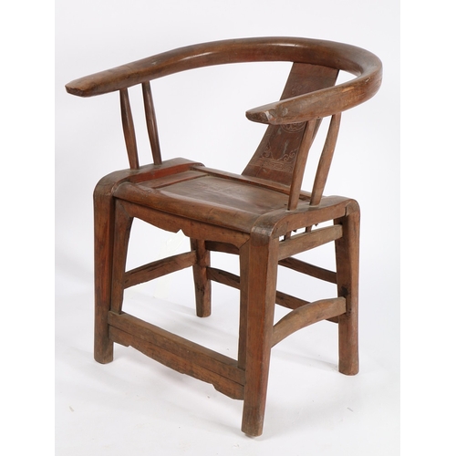 68 - A CHINESE QING DYNASTY HORSESHOE CHAIR. the splat back with central carved roundel surrounded by scr... 