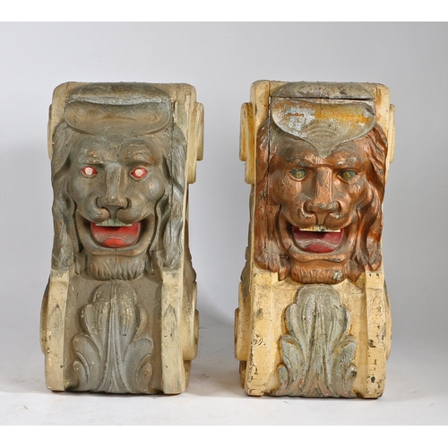 75 - A PAIR OF SUBSTANTIAL POLYCHROME PAINTED CORBELS. each with a central lion mask above an acanthus le... 