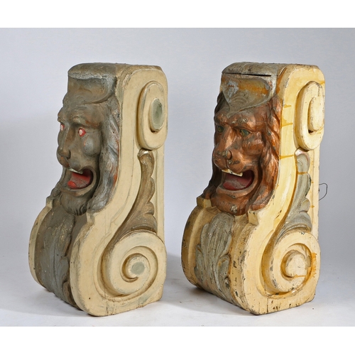 75 - A PAIR OF SUBSTANTIAL POLYCHROME PAINTED CORBELS. each with a central lion mask above an acanthus le... 