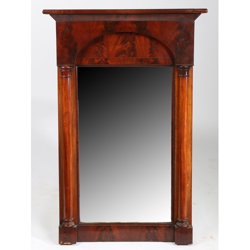 76 - A VICTORIAN MAHOGANY PIER MIRROR. the canted pediment above an arched top section and mirror plate f... 