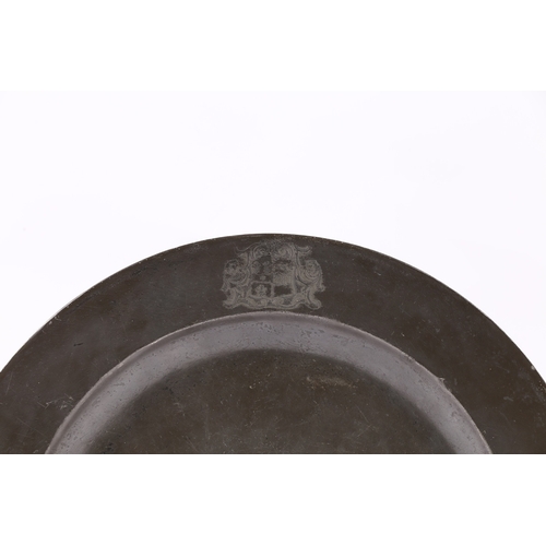 116 - A GEORGE II PLAIN RIM PEWTER DISH, AND DEEP DISH, FROM THE SAME GARNITURE, CIRCA 1730-40. Each plain... 